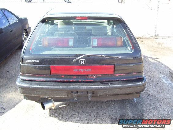 Black Honda Civic hatchback rear view with red taillight strip and 'CIVIC' badge