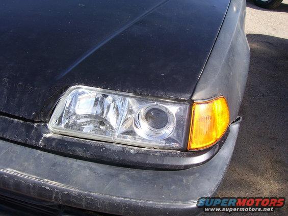 Black 1993 Mazda MX-6 front corner with clear headlight and amber turn signal
