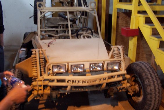 Custom dune buggy with four headlights and 'CHENG TM' on the bumper