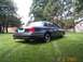 1998 Ford Crown Victoria - Rear view of a 1998 Ford Crown Victoria parked on a grassy lawn.