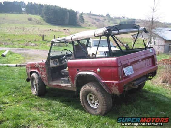 Red 1968 Ford Bronco, 3q-front view, soft top removed, license plate 653 GOB