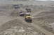 1995 Ford Bronco - A convoy of Jeeps navigates a desert landscape, kicking up dust on the sandy trails.