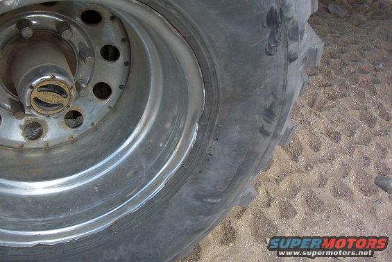Close-up of a chrome wheel with a WARN locking hub and a large tire