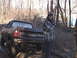 1980 Dodge Magnum - A person stands next to a Dodge Ram pickup truck in a muddy, wooded area.