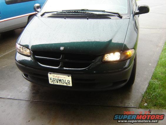 1997 Dodge Grand Caravan front with California license plate 5RVM048. Another vehicle is partially visible to the left