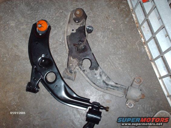 New black control arm next to old rusty one