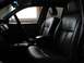 2003 Ford Crown Victoria - Interior view of a vehicle showing the front seats, dashboard, and center console.
