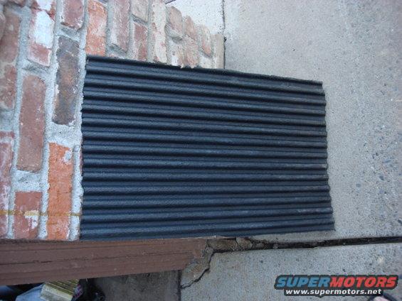 tank-mat.jpg i wanted to have a way to get the dirt out from under the tank. i had this chunk of bed liner on the side yard. this will add 1-1 1/2"s to the height of the tank. but it will keep the metal to metal contact gone.