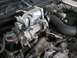 2003 Ford Crown Victoria - Close-up of engine parts, possibly from a 2003 Ford Crown Victoria, during maintenance or repair.