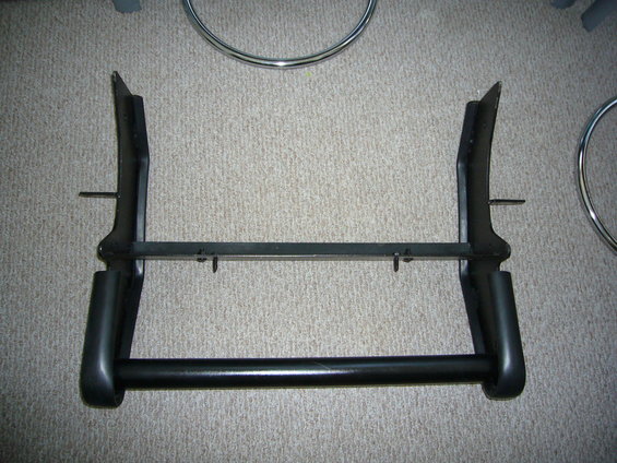 Black bull bar with horizontal crossbar and two vertical supports. Appears to be a vehicle accessory