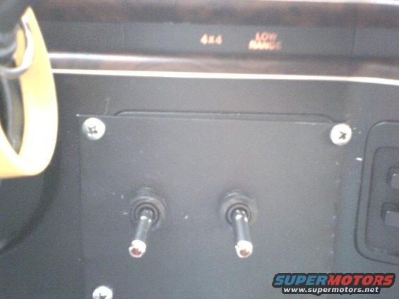 Interior dashboard with toggle switches and 4x4 low range indicators