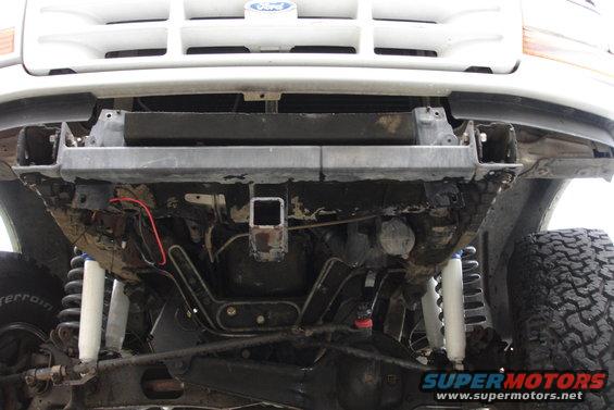 1996 Ford Bronco front undercarriage with visible hitch receiver and suspension components