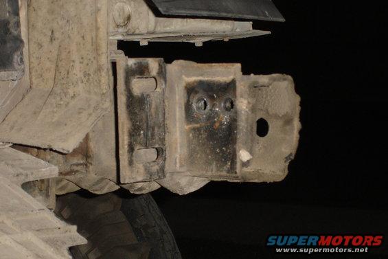 Rusted bumper bracket on a vehicle