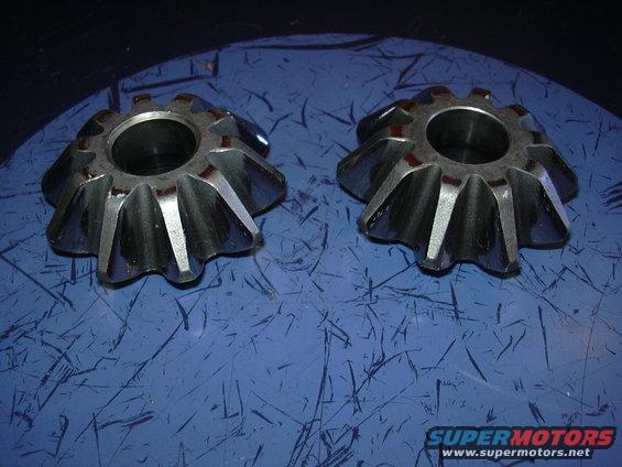 Two differential gears on a blue surface