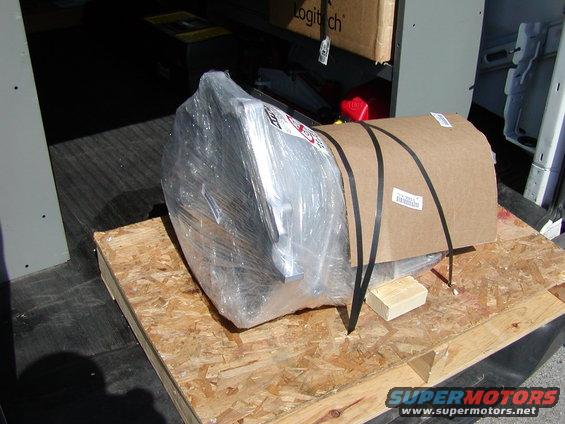 Transmission wrapped in plastic and cardboard on a pallet