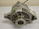 1989 Ford Bronco - This is an automotive alternator, a key component for charging a vehicle's battery.
