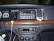 2002 Ford Crown Victoria - The dashboard features an iPod, a GPS unit, and additional gauges below the climate controls.