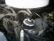 1985 Ford Crown Victoria LTD - The engine bay of a vehicle, focusing on the coolant reservoir and surrounding components.