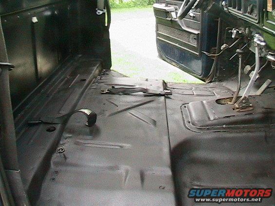 1977 Ford F-250 interior showing floor pan and dashboard area with open door