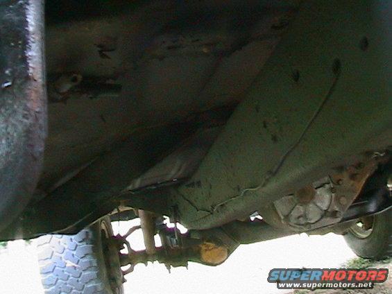 Underside of 1977 Ford F-250 frame, showing suspension and rear tire