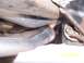 1994 Ford Bronco - Close-up view of a vehicle's exhaust system, showing the pipes and undercarriage components.