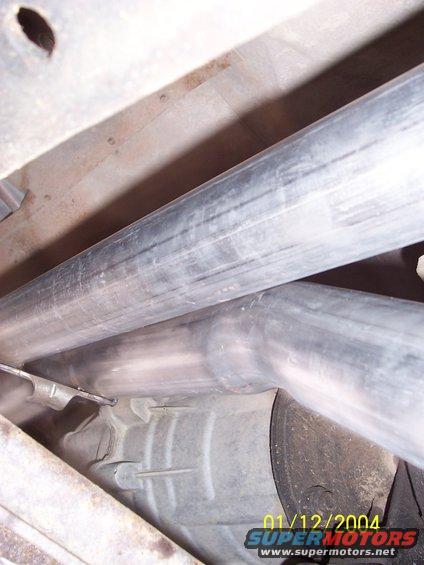Close-up of exhaust pipes and undercarriage components