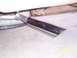 1994 Ford Bronco - A close-up view of a chrome exhaust tip, likely from a vehicle's exhaust system.