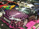 1994 Ford Probe - A custom black convertible with a striking pink spider web graphic design is displayed indoors.