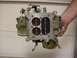 1972 Ford Ranchero - A hand holds a carburetor, a critical engine component for mixing air and fuel.