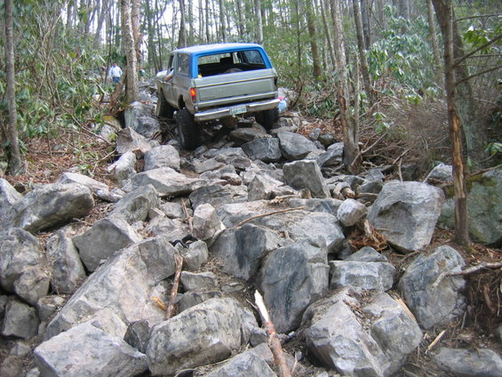 Silver and blue 1979 Ford F-Series truck on rocky trail