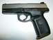 1982 Chevrolet C/K Pickup - Smith & Wesson SW40VE pistol shown against a white background.