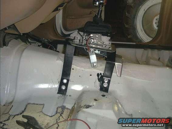 shifter5.jpg heres a good side shot, you can see how i uses the indent in the cars tranny tunel for a bit of extra strenth. i also left the rear bracet long so i could have it sittting flus to the floor. its very strong, stronger than i first figured it would be the original plan called for more steel.