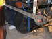 1978 Ford Bronco - A mechanic works on a vehicle's suspension system, with a Rough Country shock absorber clearly visible.