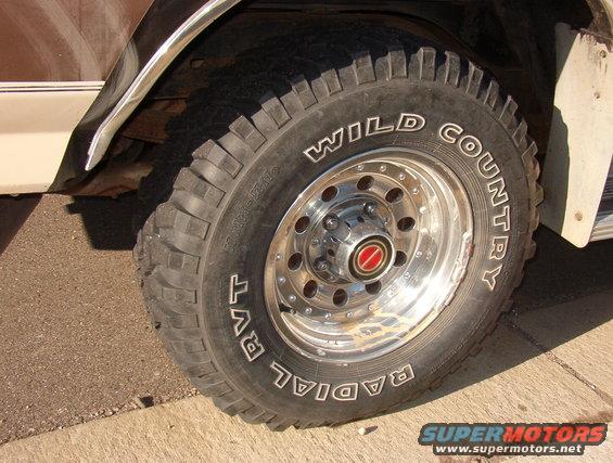 1993 Ford Bronco front wheel with Wild Country Radial RVT tires and chrome rim