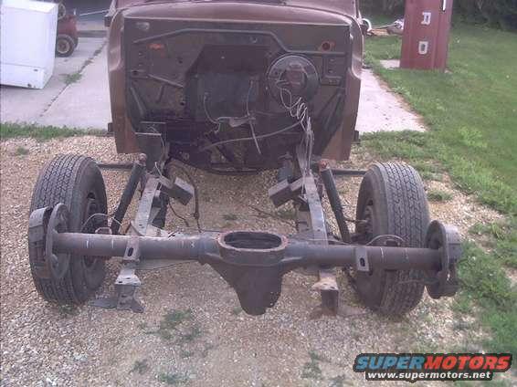 1948 Ford F3 chassis with rear axle and wheels, brown cab, outdoors