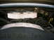 1985 Ford Crown Victoria LTD - Close-up view of an engine bay, a chrome-plated air cleaner assembly and visible warning text.