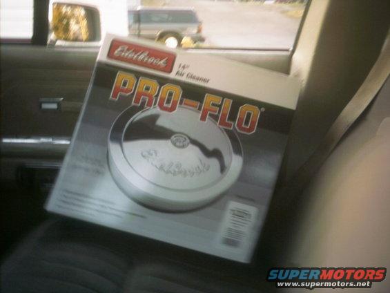 Box for an Edelbrock Pro-Flo 14" air cleaner, sitting on a car seat