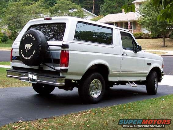 White 1996 Ford Bronco, rear quarter view, parked on asphalt driveway