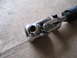 1979 Ford Bronco - Close-up of a chrome steering shaft universal joint, likely a replacement part.