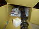 1976 Ford F-100 - Camshaft and foam block are inside a cardboard box with packaging materials.
