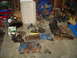 1976 Ford F-100 - Various engine components are laid out on the floor of a garage.