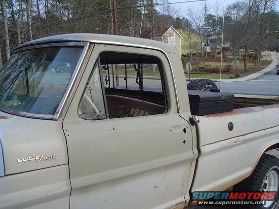 1967 Ford F-250 Camper Special truck, side view, light tan and white paint, with a toolbox and spare tire in the bed
