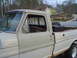 1967 Ford F-250 - This 1967 Ford F-250 Camper Special shows its side profile, with a toolbox and spare tire visible in the bed.