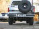 1996 Ford Bronco - I got the exhaust for christmas, and decided to try mounting the hi-lift on the carrier. the weight of it rests on the bumper so hopefully…