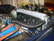 1979 Ford Bronco - Close-up view of an engine bay, highlighting a custom radiator and fan setup with visible hoses and engine components.
