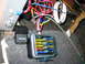1979 Ford Bronco - The vehicle's electrical system includes a multi-fuse block and several relays, with a tangle of colorful wires.