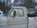 1967 Ford F-250 - Side view of a 1967 Ford F-250 pickup truck, its door and a toolbox.