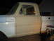 1967 Ford F-250 - This 1967 Ford F-250 shows its side profile, with the cab painted beige and the fender in blue, suggesting a work in progress.