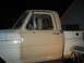 1967 Ford F-250 - The side profile of a 1967 Ford F-250 pickup truck is visible, with a toolbox in the bed.