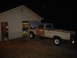 1967 Ford F-250 - A 1967 Ford F-250 pickup truck is parked outside a garage with its hood up.
